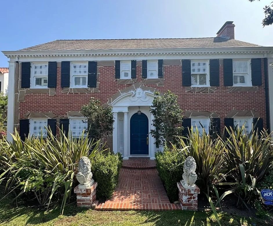 Detailed exterior prep work on a large traditional home