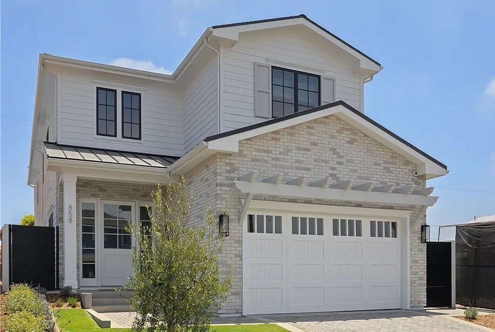 Repainted estate home exterior with crisp white trim