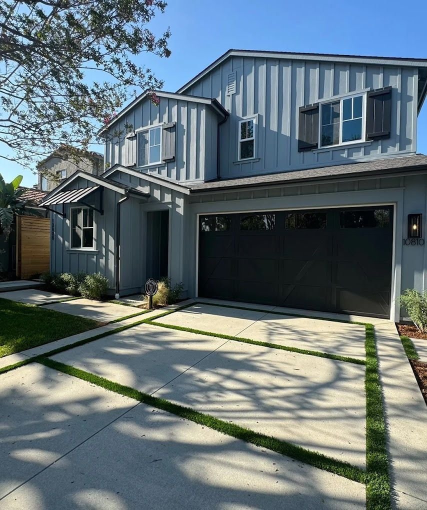 Freshly painted hillside home exterior with clean trim lines
