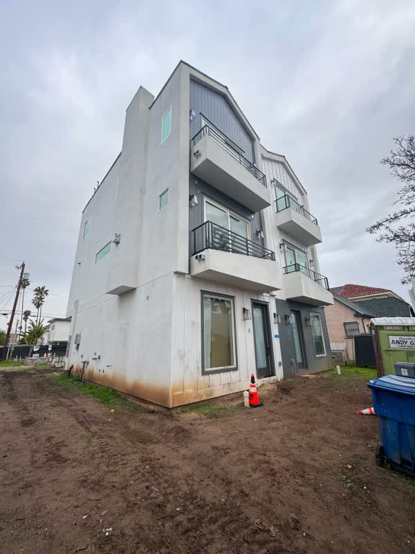 Multi-level coastal home illustrating balcony access and elevation planning
